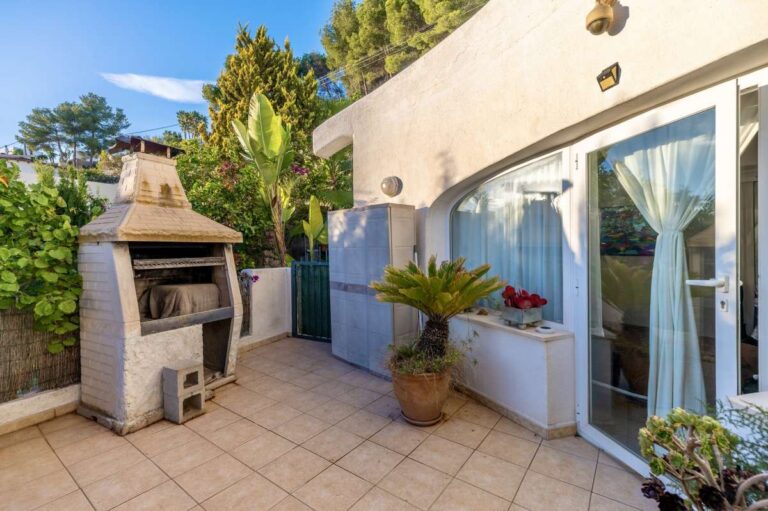Terrace at a Benissa sea view villa with built-in barbecue, outdoor seating area and Mediterranean planting