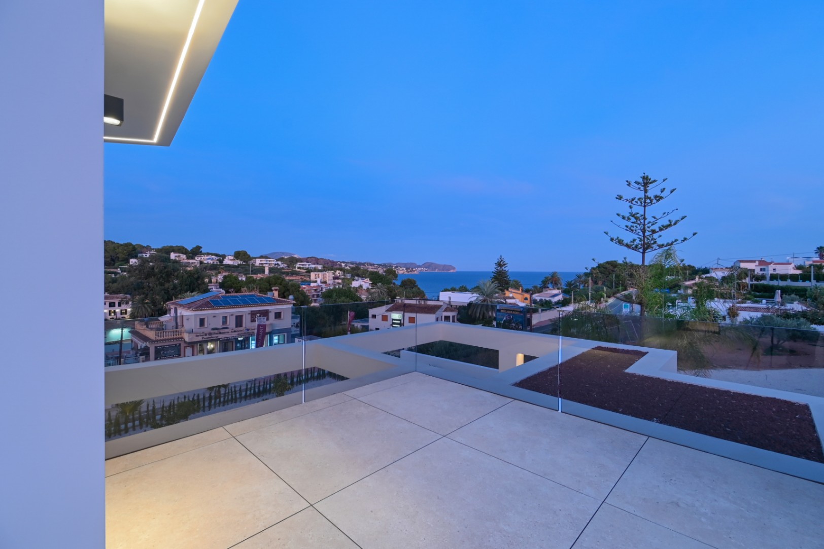Terrace at dusk with sea views at luxury villa near La Fustera Beach