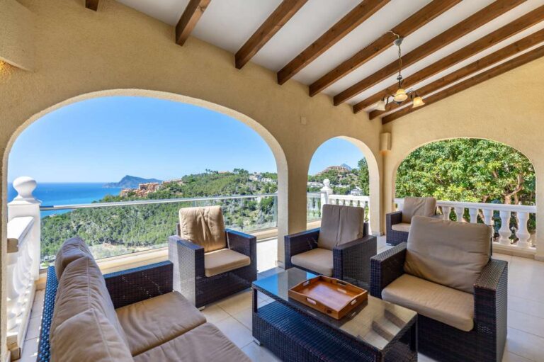 Terrace lounge at an elegant Mediterranean villa in Altea Hills with outdoor seating, sea views and views across the coastline