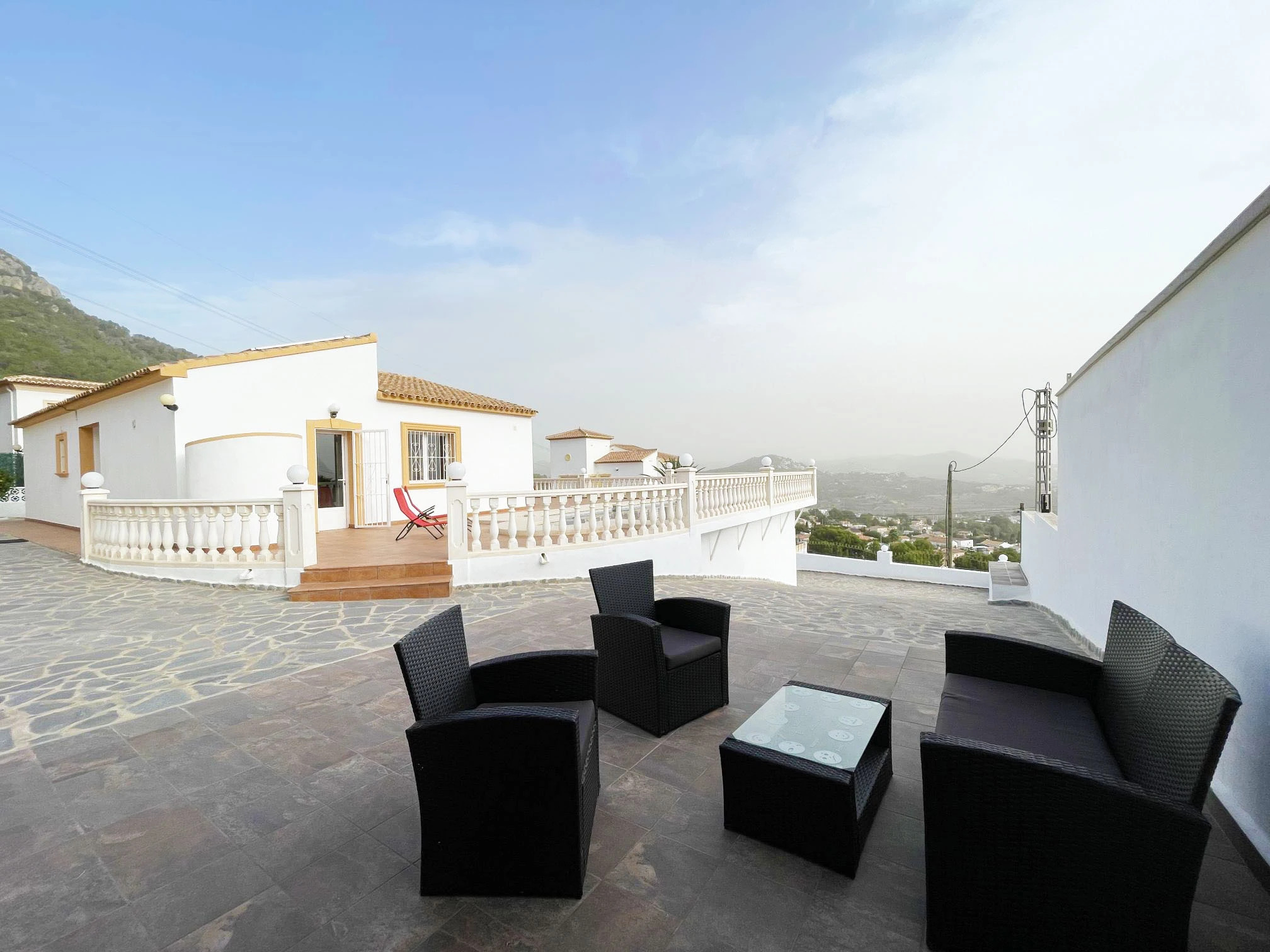 Terrace seating area with open views at detached villa in Calpe