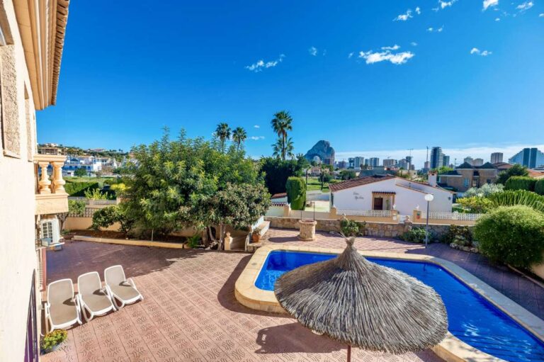Terrace view over the swimming pool and surrounding area at a spacious villa with guest apartments in Calpe.