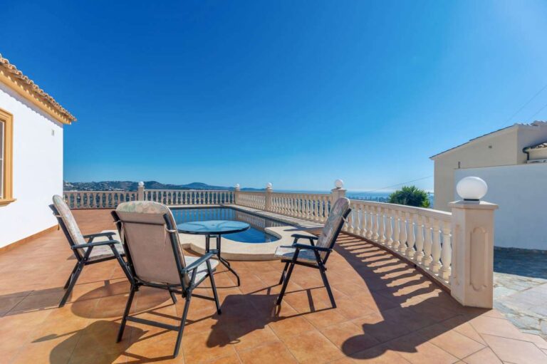 Terrace with outdoor seating and open sea views at a villa in Calpe.
