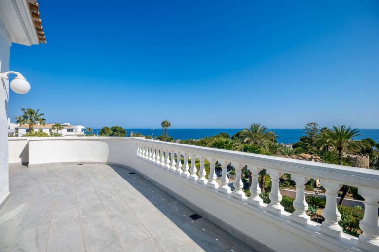 Terrace with sea views and white balustrade at a villa in Calpe.