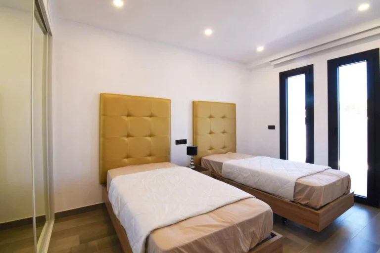 Twin bedroom with built-in wardrobes in modern villa in Carrió, Calpe