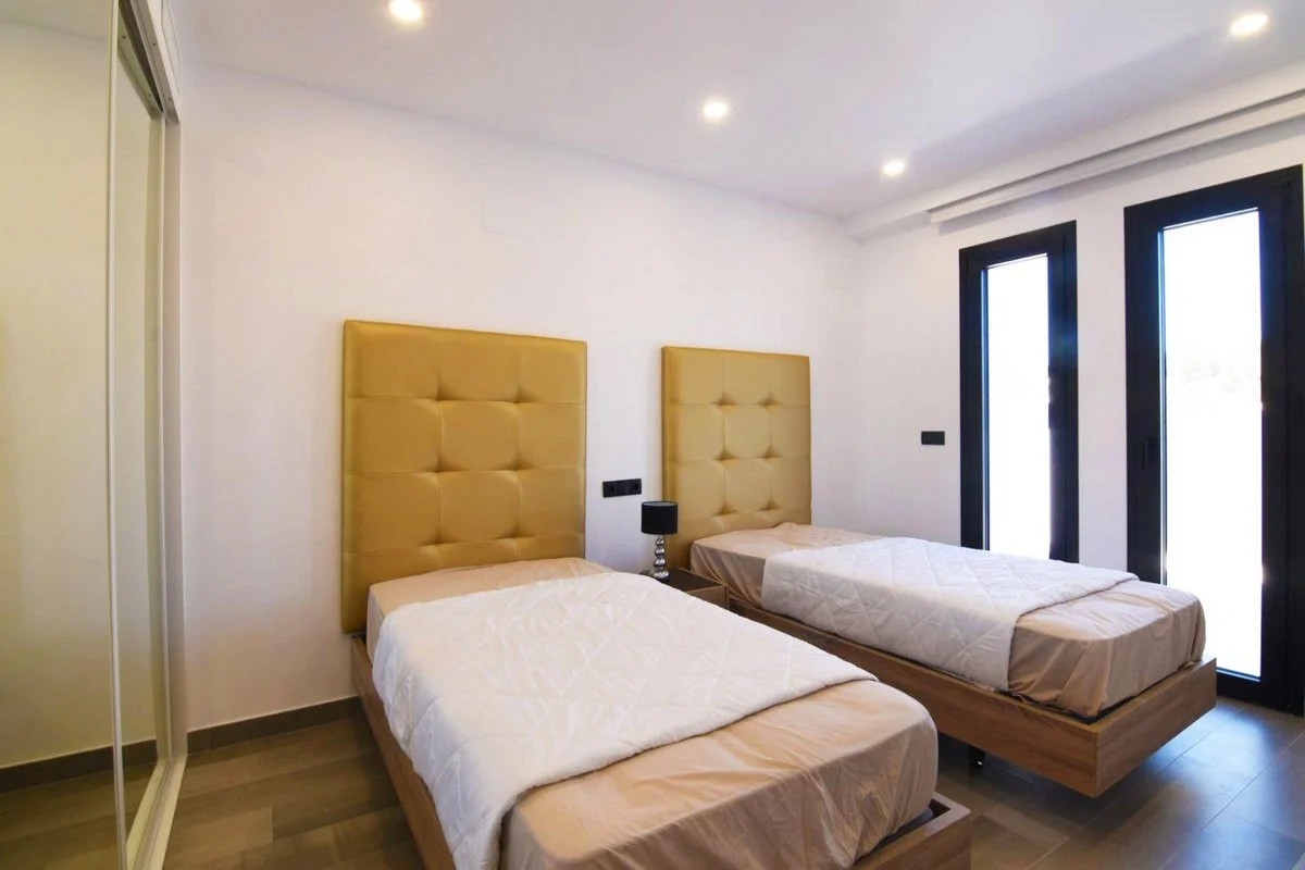 Twin bedroom with built-in wardrobes in modern villa in Carrió, Calpe