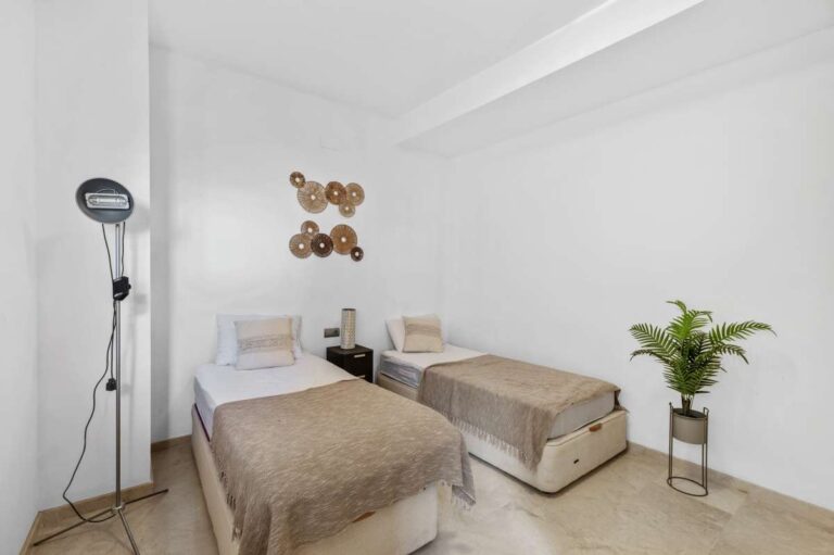 Twin bedroom with natural light inside a modern spacious villa for sale in Calpe.