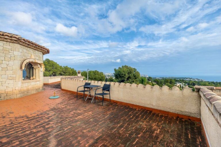 Upper terrace at a finca-style villa in Benissa Costa with open sea views, tiled flooring, outdoor seating and rustic Mediterranean architecture