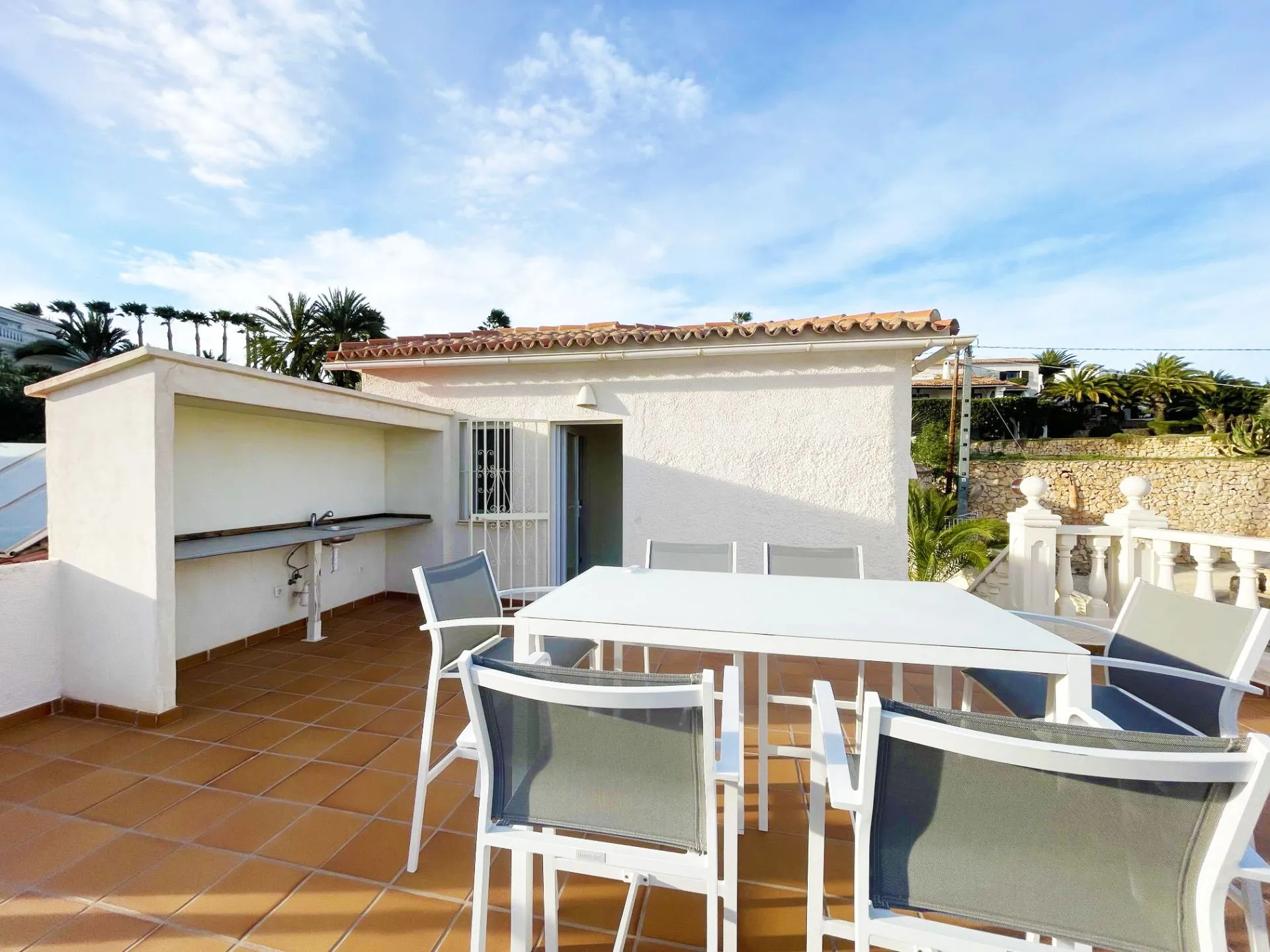 Upper terrace dining area at renovated villa in Calpe