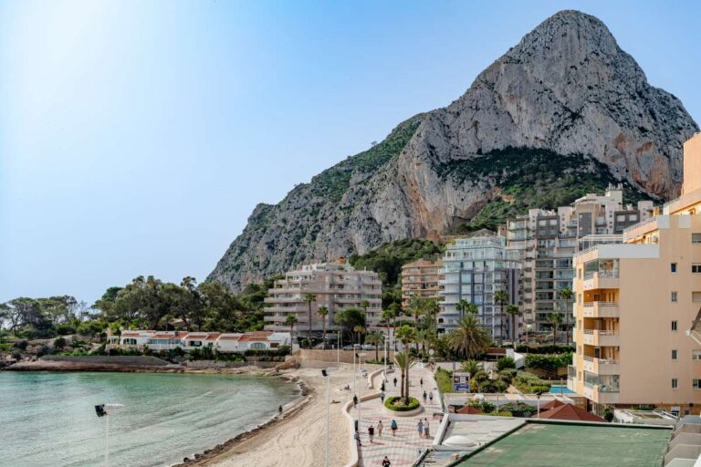 Views from a beachfront apartment by La Fossa Beach in Calpe showing the Peñón de Ifach, sandy beach, promenade and Mediterranean Sea