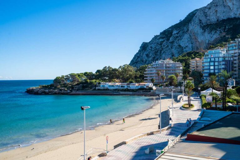 Views from a beachfront apartment by La Fossa Beach in Calpe showing the sandy beach, Mediterranean Sea and Peñón de Ifach