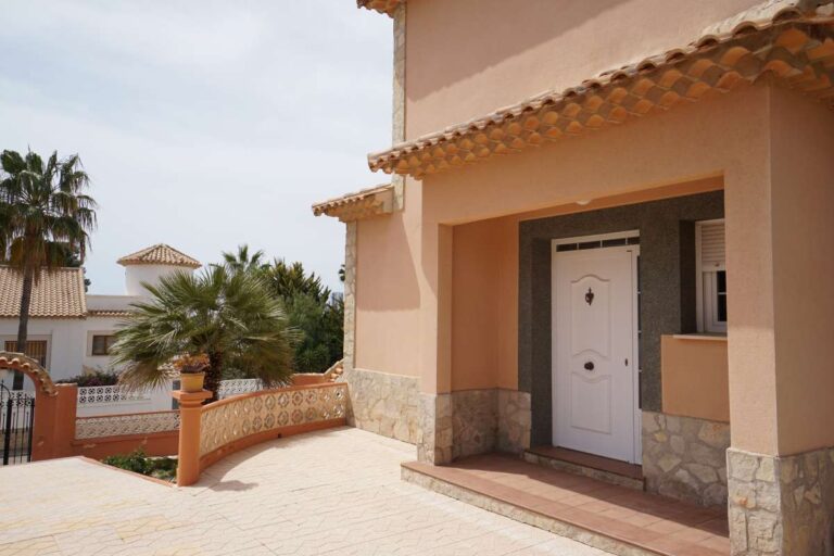 Villa entrance terrace with traditional Mediterranean exterior near La Calalga Beach in Calpe.