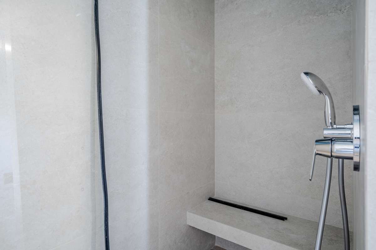 Walk-in shower with modern fixtures inside a new build villa for sale in Calpe