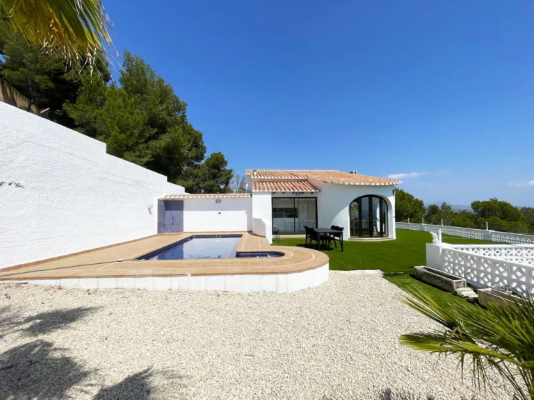 White villa exterior with private pool and garden in Oltamar, Calpe
