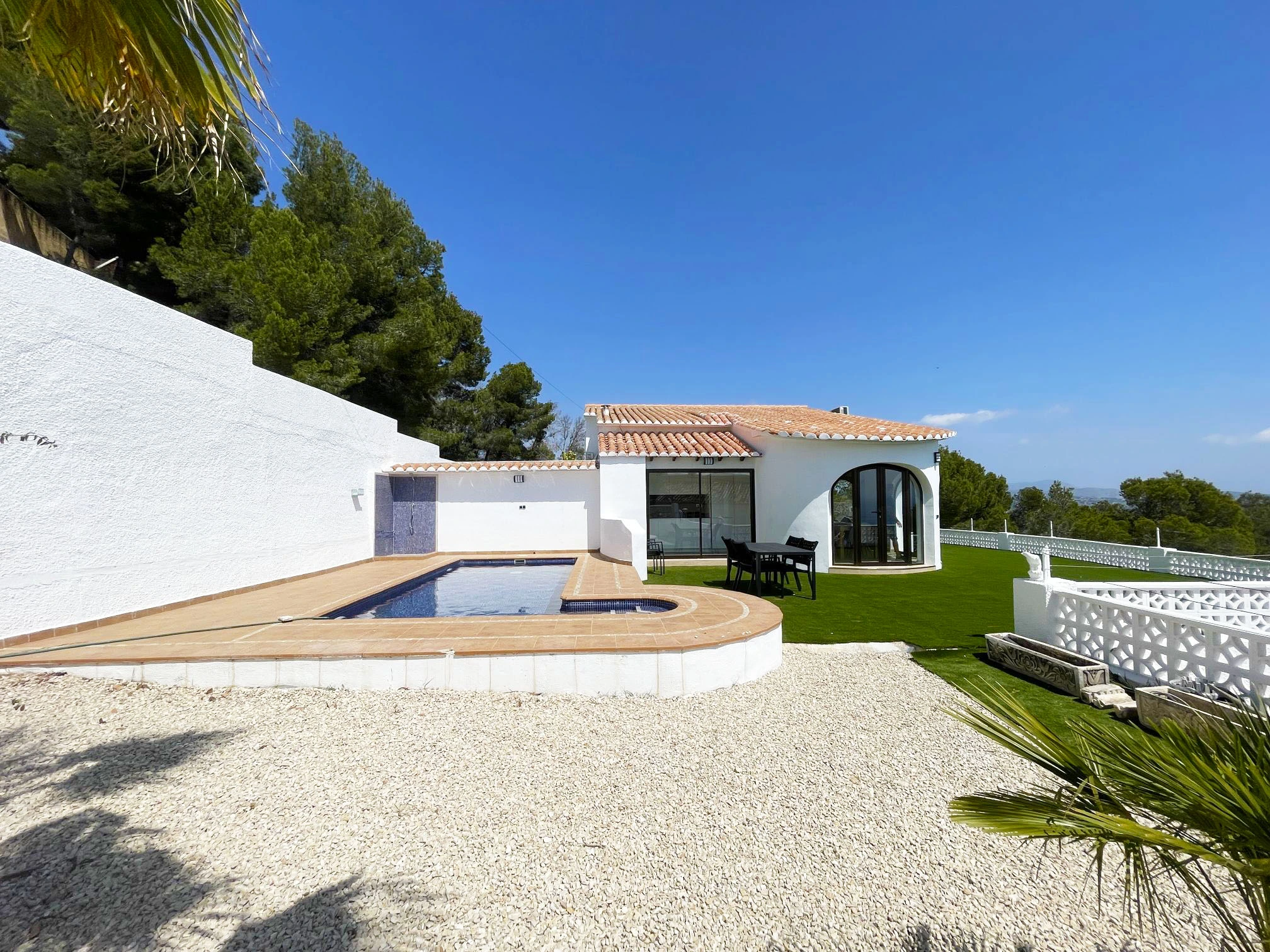 White villa exterior with private pool and garden in Oltamar, Calpe