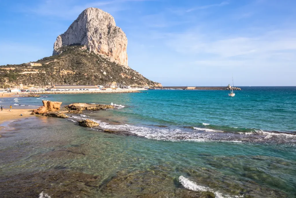Arenal-Bol Beach in Calpe with clear Mediterranean water, Peñón de Ifach and the marina in the background