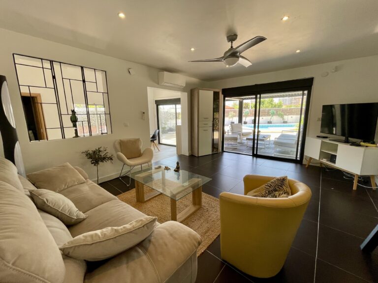 Bright living room in a Calpe villa with sliding doors leading to the pool terrace