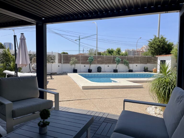 Covered terrace overlooking the private swimming pool at a villa in Calpe