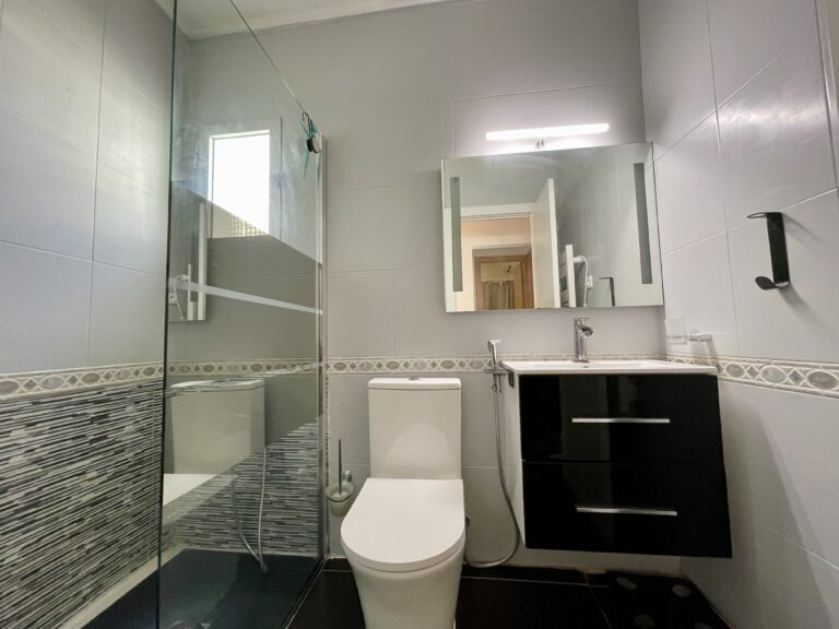 Modern bathroom with walk-in shower in a villa for sale in Calpe