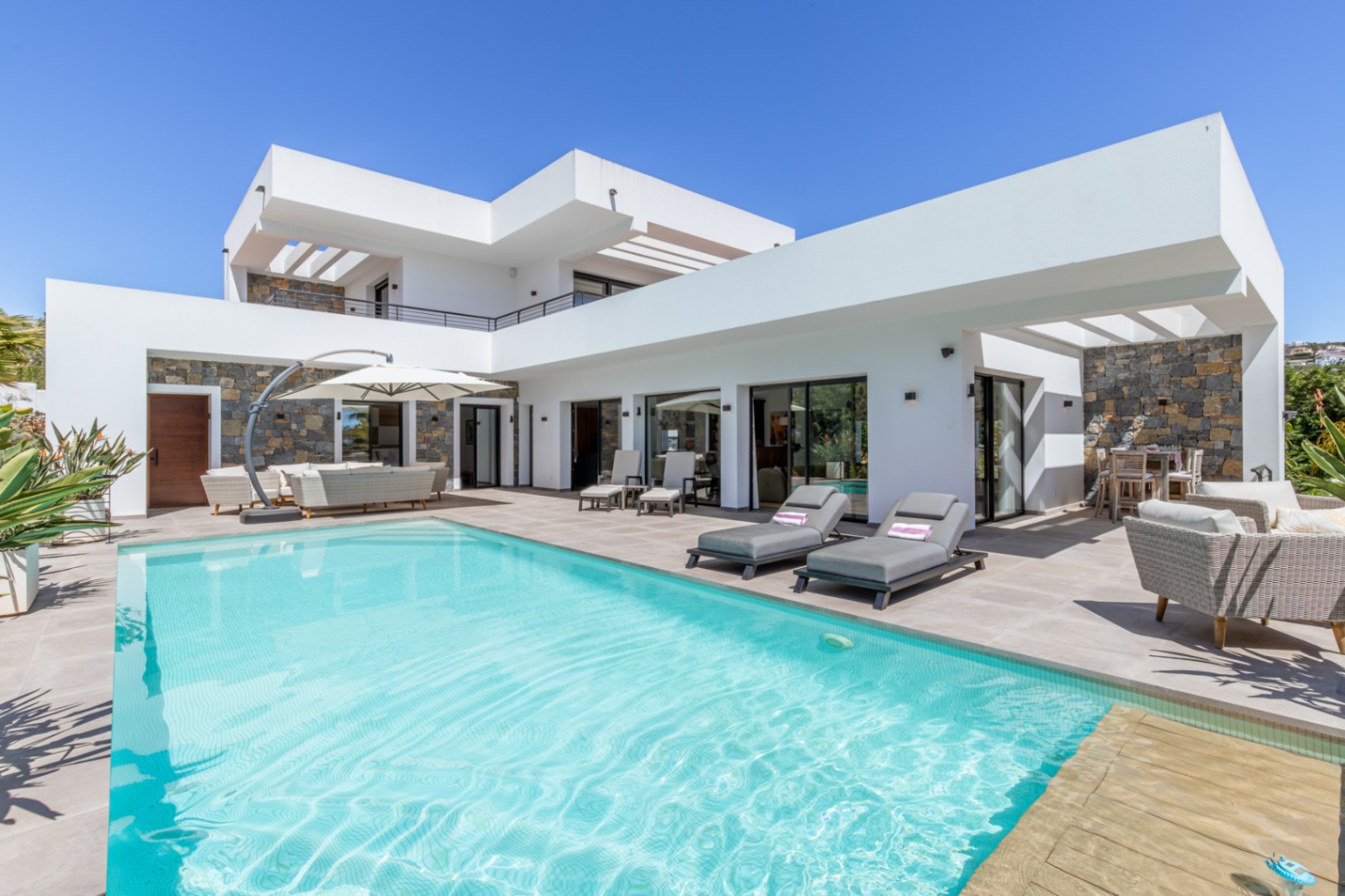 Modern villa in Solpark, Moraira with heated swimming pool, white contemporary exterior, sun terrace and private outdoor seating area