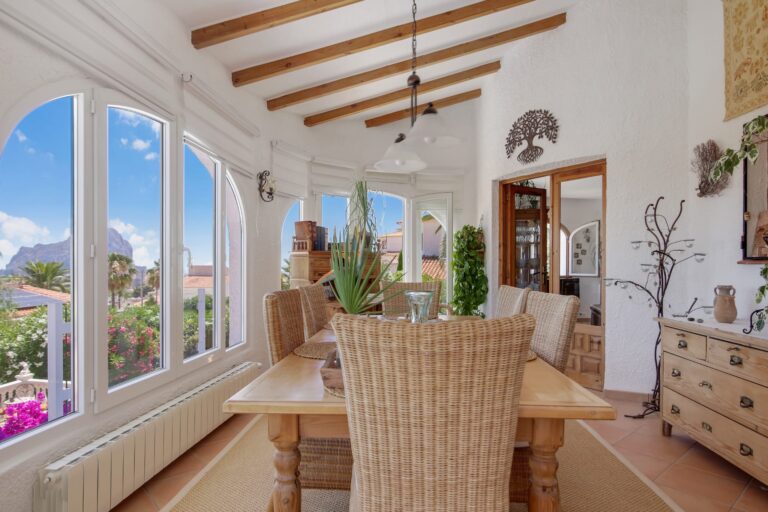 Dining area with Mediterranean sea views in a villa with guest apartment in Calpe